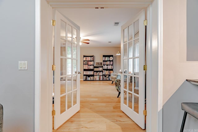 1321 W Front St, Heber Springs, AR 72543 - corridor with visible vents, plenty of natural light, french doors, and light wood-style flooring