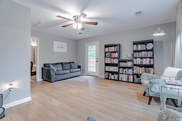 1321 W Front St, Heber Springs, AR 72543 - living area featuring a ceiling fan, baseboards, visible vents, and light wood-style floors
