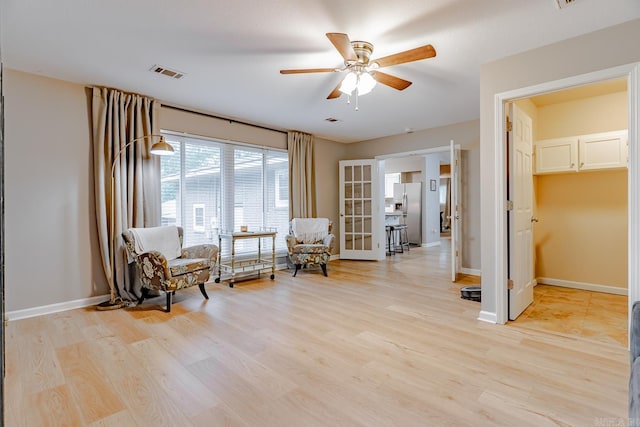 1321 W Front St, Heber Springs, AR 72543 - sitting room featuring visible vents, a ceiling fan, baseboards, and light wood-type flooring