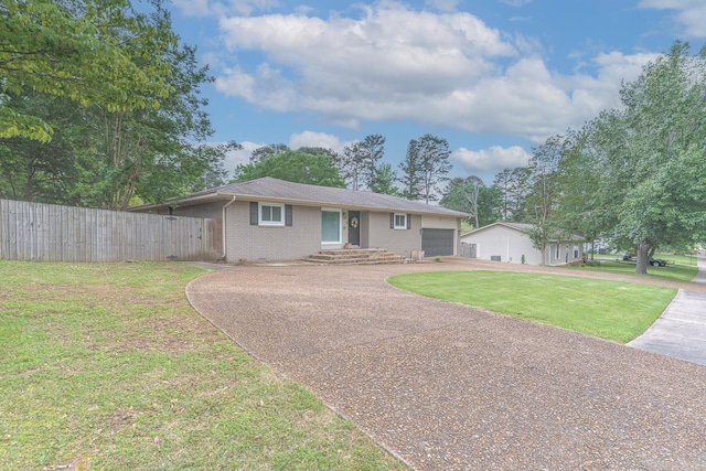1321 W Front St, Heber Springs, AR 72543 - ranch-style house with brick siding, fence, driveway, and a front yard