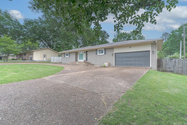 1321 W Front St, Heber Springs, AR 72543 - single story home with concrete driveway, brick siding, fence, and a front lawn