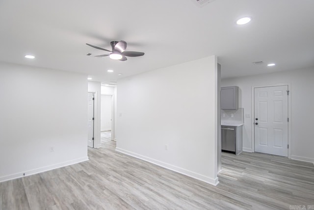 unfurnished living room with baseboards, ceiling fan, light wood finished floors, and recessed lighting