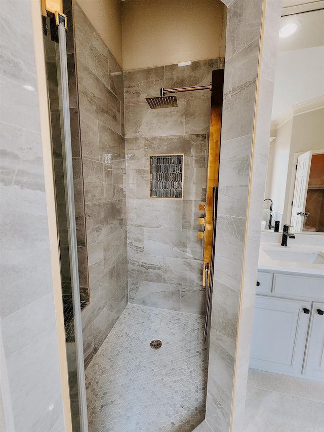 full bath with vanity and tiled shower
