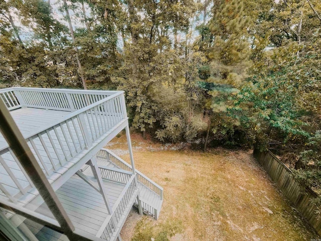 view of yard with fence and a deck