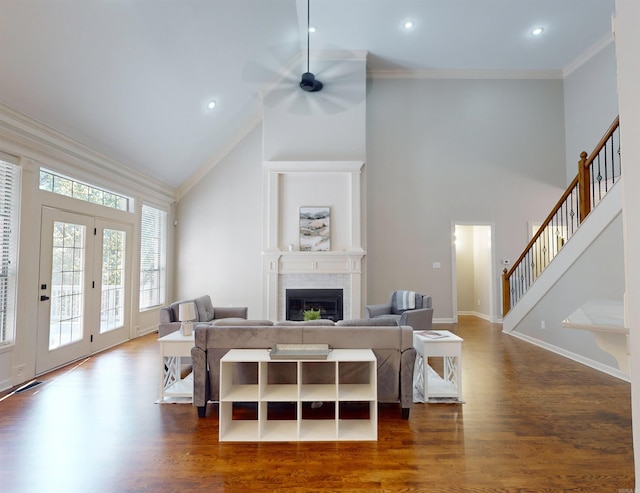 living area with high vaulted ceiling, ornamental molding, dark wood-style flooring, and ceiling fan