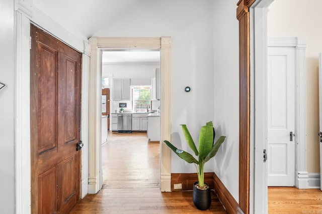 1509 S Spring, Little Rock, AR 72202 - hallway featuring vaulted ceiling and light wood-style flooring