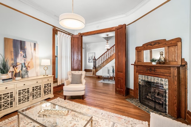 1509 S Spring, Little Rock, AR 72202 - living area with a fireplace, wood finished floors, baseboards, ornamental molding, and stairs