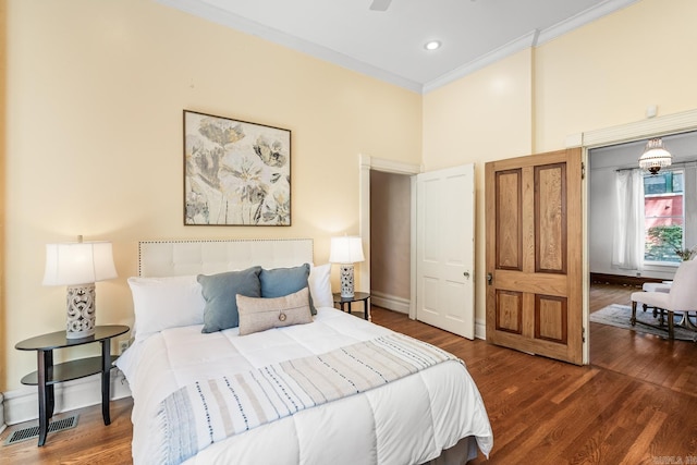 1509 S Spring, Little Rock, AR 72202 - bedroom featuring crown molding, baseboards, wood finished floors, and visible vents