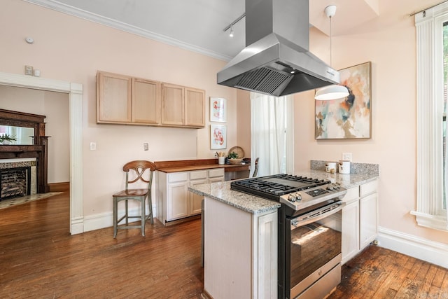 1509 S Spring, Little Rock, AR 72202 - kitchen featuring stainless steel range with gas cooktop, baseboards, dark wood finished floors, and island exhaust hood