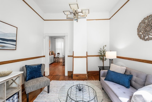 1509 S Spring, Little Rock, AR 72202 - living area with baseboards, an inviting chandelier, and wood finished floors