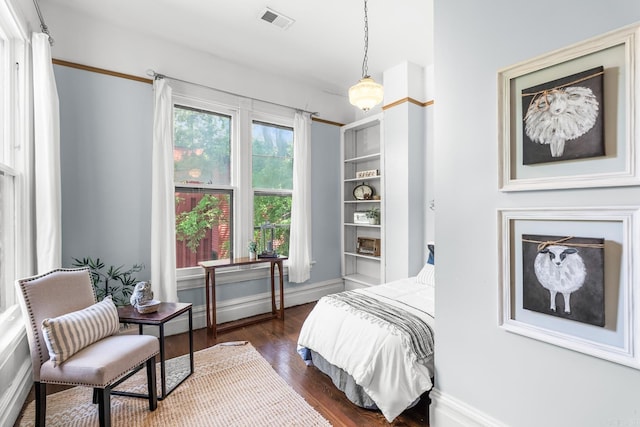 1509 S Spring, Little Rock, AR 72202 - bedroom with baseboards, dark wood-style flooring, and visible vents