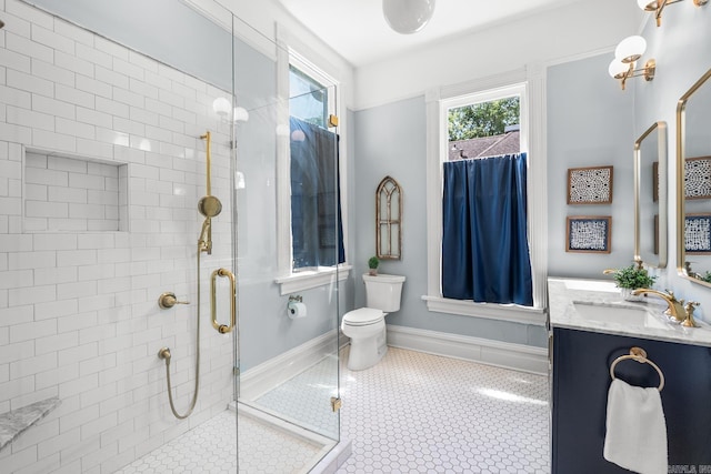 1509 S Spring, Little Rock, AR 72202 - bathroom with a shower stall, tile patterned floors, vanity, baseboards, and toilet