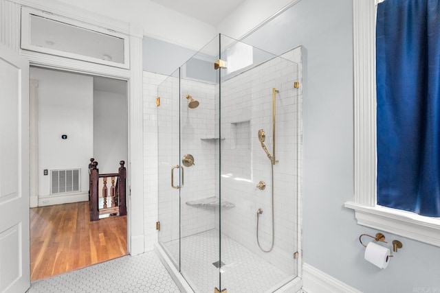 1509 S Spring, Little Rock, AR 72202 - full bathroom with tile patterned floors, visible vents, baseboards, and a stall shower