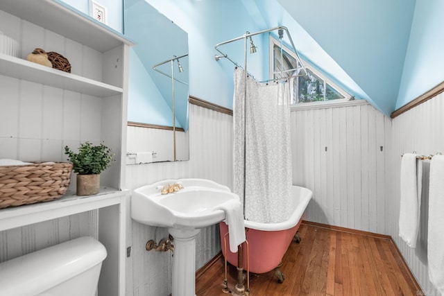 1509 S Spring, Little Rock, AR 72202 - full bathroom featuring toilet, a shower with curtain, a freestanding bath, and wood finished floors