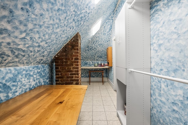 1509 S Spring, Little Rock, AR 72202 - interior space with tile patterned floors, vaulted ceiling, and wallpapered walls