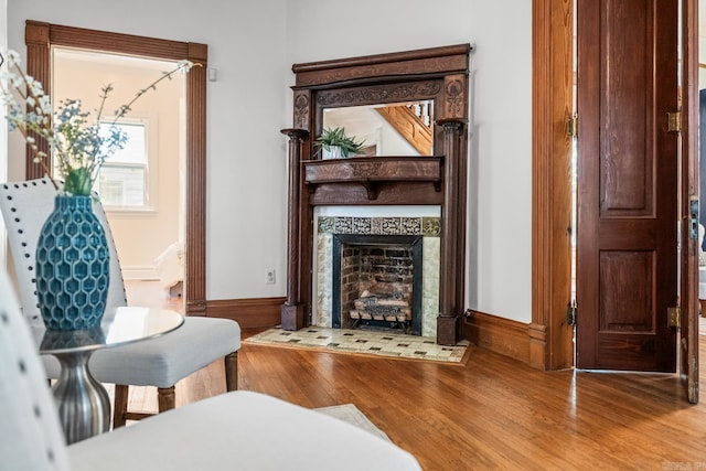 1509 S Spring, Little Rock, AR 72202 - sitting room featuring baseboards, a tiled fireplace, and wood finished floors