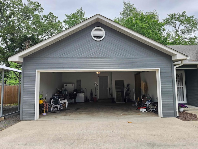 garage featuring fence