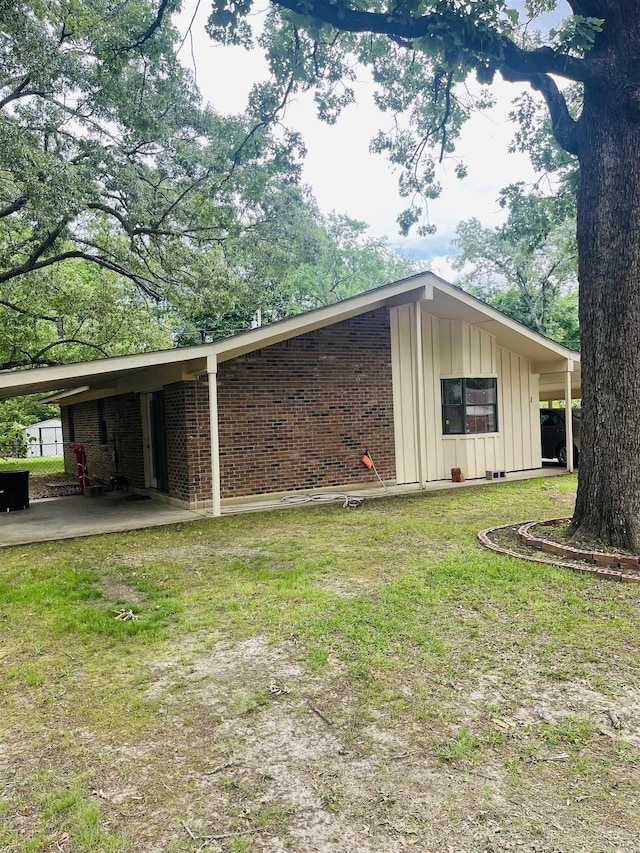 view of outdoor structure featuring an attached carport