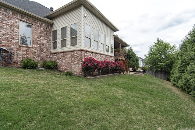 9241 Johnson Dr, Sherwood, AR 72120 - view of side of home with a yard and brick siding