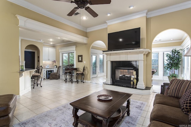 9241 Johnson Dr, Sherwood, AR 72120 - living area featuring a high end fireplace, a ceiling fan, light tile patterned flooring, and a wealth of natural light