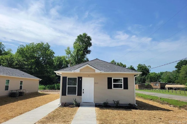 bungalow-style house with a shingled roof
