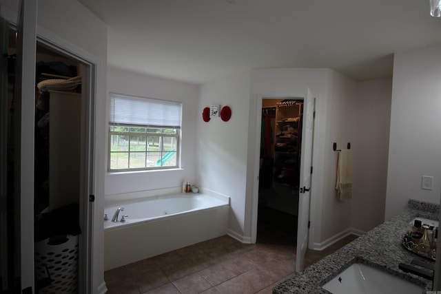 24076 Gracie Layne Ln, Bauxite, AR 72011 - full bathroom with tile patterned flooring, a bath, and a spacious closet