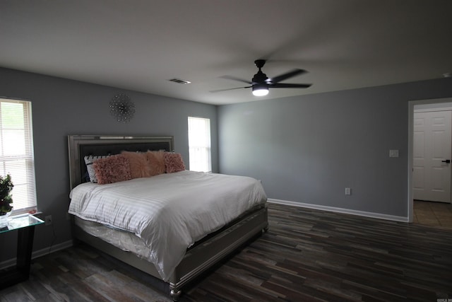 24076 Gracie Layne Ln, Bauxite, AR 72011 - bedroom featuring baseboards, visible vents, dark wood-style floors, and ceiling fan