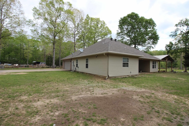24076 Gracie Layne Ln, Bauxite, AR 72011 - view of home's exterior with a lawn, driveway, a shingled roof, and a garage