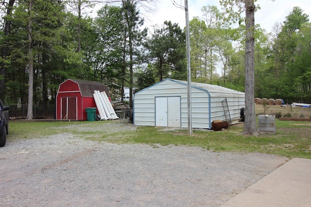 24076 Gracie Layne Ln, Bauxite, AR 72011 - view of shed featuring fence