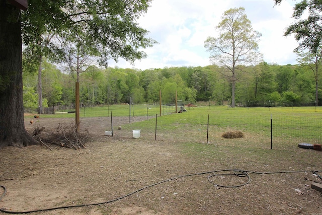 24076 Gracie Layne Ln, Bauxite, AR 72011 - view of yard featuring fence and a view of trees