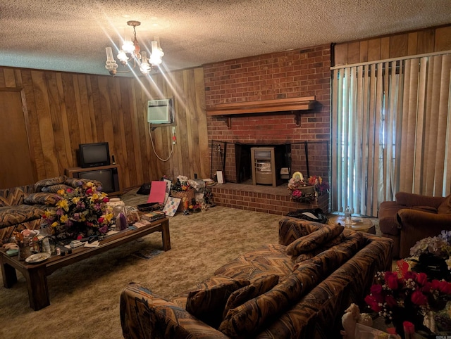 carpeted living area featuring an AC wall unit, wood walls, a textured ceiling, and a brick fireplace