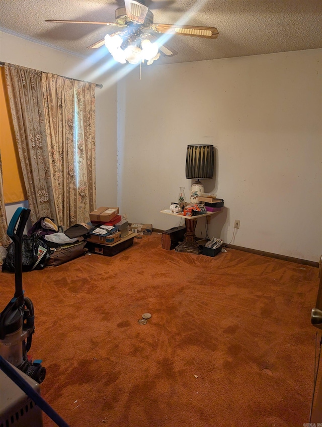 interior space with ceiling fan and baseboards