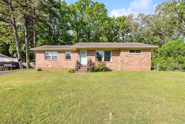 single story home with brick siding, fence, and crawl space