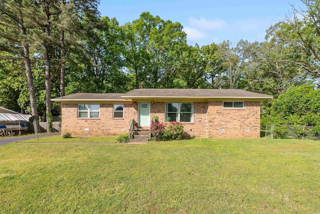 single story home with fence, a front lawn, brick siding, and crawl space