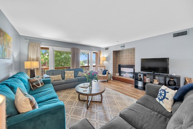 350 Peters Pt Unit L1, Hot Springs, AR 71913 - living room with visible vents, wood finished floors, and a fireplace