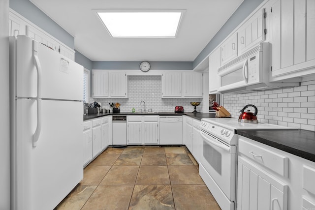 350 Peters Pt Unit L1, Hot Springs, AR 71913 - kitchen with white appliances, dark countertops, a sink, and tasteful backsplash