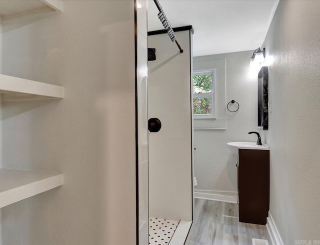 419 S Ave, Hot Springs, AR 71913 - full bath featuring vanity, a walk in shower, baseboards, and wood finished floors