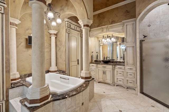 full bath featuring ornate columns, a bath, a stall shower, and vanity