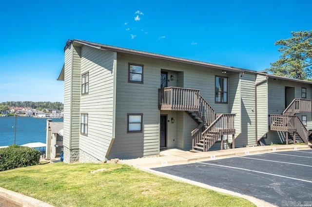 120 Catalina Cir Unit 2A, Hot Springs, AR 71913 - exterior space featuring stairs, a water view, and uncovered parking