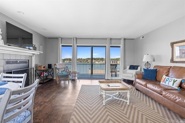 120 Catalina Cir Unit 2A, Hot Springs, AR 71913 - living area featuring a water view, a fireplace, wood finished floors, and visible vents