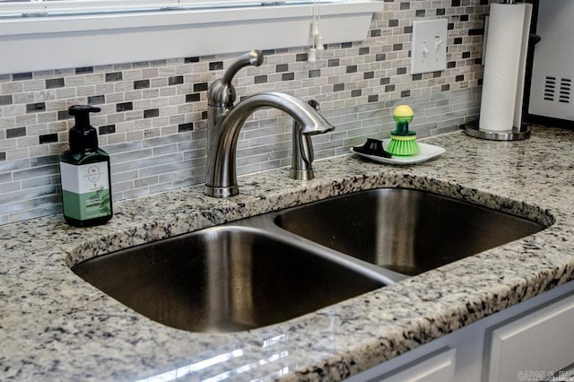 120 Catalina Cir Unit 2A, Hot Springs, AR 71913 - details with white cabinetry, light stone counters, a sink, and tasteful backsplash