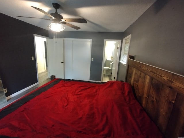 bedroom with connected bathroom, baseboards, and ceiling fan