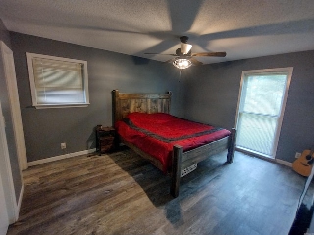 bedroom with ceiling fan, a textured ceiling, pool table, wood finished floors, and baseboards