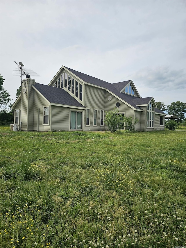 161 Funderburg Rd, Mineral Sprs, AR 71851 - rear view of house featuring a lawn and a chimney
