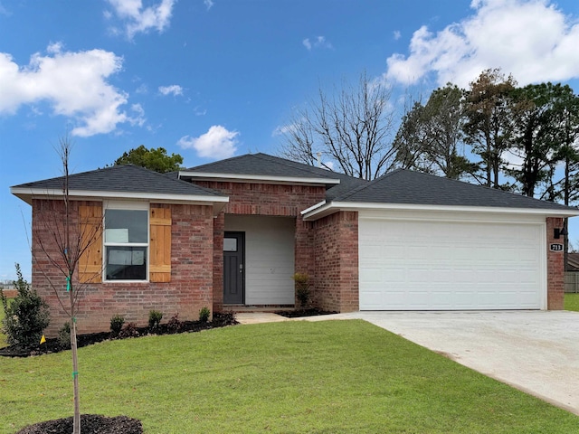 single story home featuring brick siding, a garage, a front lawn, and concrete driveway