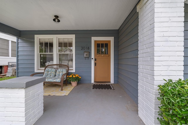 doorway to property featuring a porch