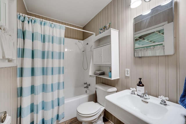 full bath with shower / bath combo with shower curtain, a sink, and toilet