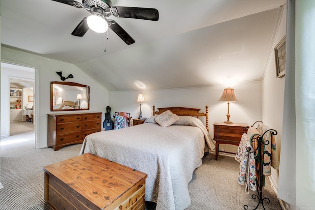 bedroom featuring ceiling fan, light carpet, and vaulted ceiling