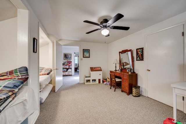 bedroom with a ceiling fan and light colored carpet