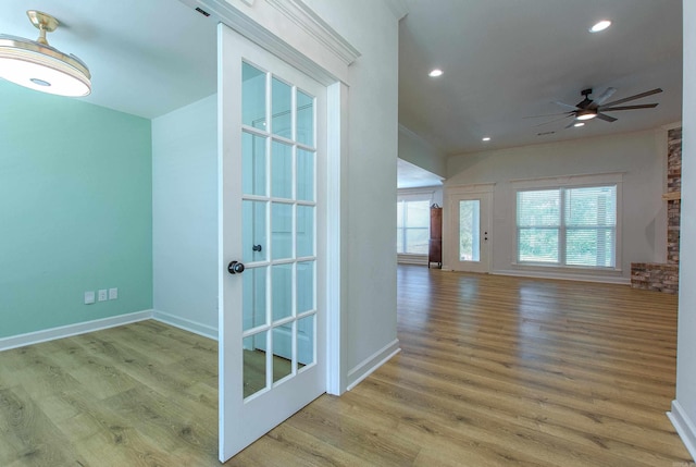 empty room with baseboards, ceiling fan, recessed lighting, and wood finished floors